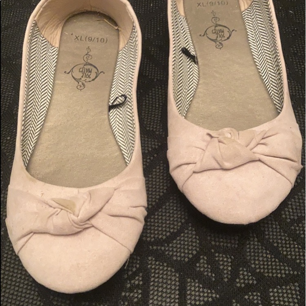 Sole Mates Crème colored flats.
